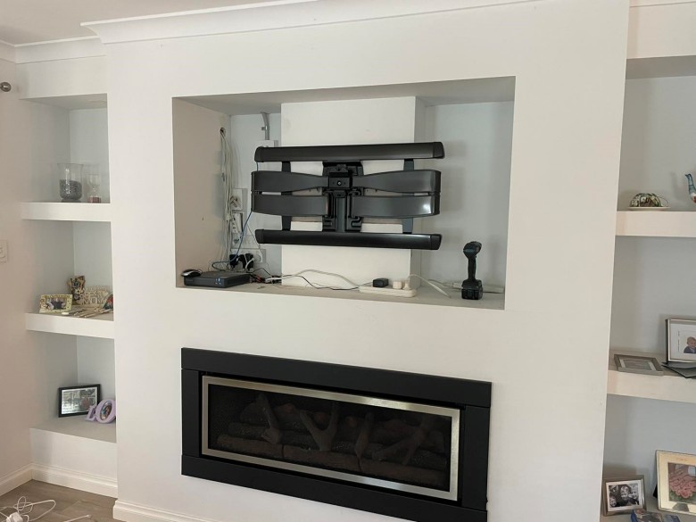 sanus xl cantilever tv bracket mounted in the wall recess