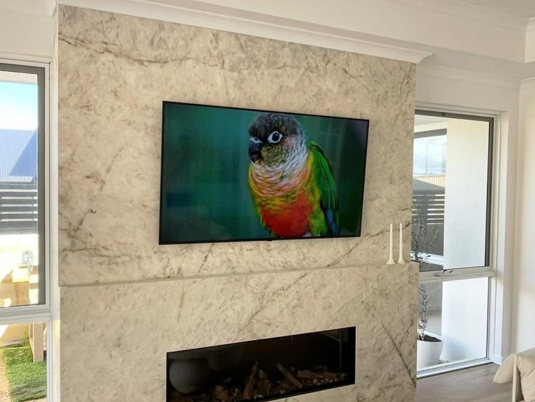 tv mounting on porcelain wall in iluka home